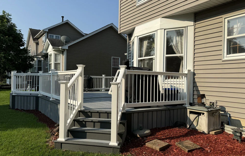 Deck Stairs And Railing Attached To House Near Ledger Board Area